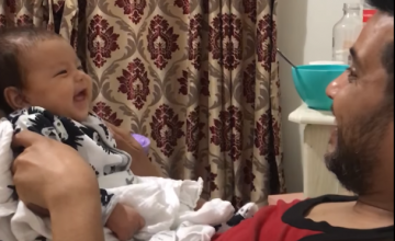 9 week old baby laughing with daddy